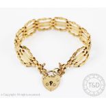 A 9ct gold gate type bracelet with padlock clasp and safety chain, gross weight 16.