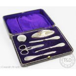 A cased George V silver manicure set,