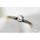 A solitaire diamond ring, the cushion shaped old cut diamond within eight claw,