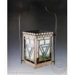 A late Victorian stained glass and brass hall lantern, of rectangular form,