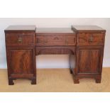 An early 19th century mahogany pedestal sideboard,