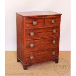 A 19th century mahogany bow front chest, of two short and three long drawers, on bracket feet,
