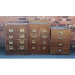 Two vintage school banks of drawers, each with eight drawers on plinth base,