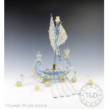 A Venetian blue and gilt glass model of a galleon, with ten clear glass oars, 40cm high,