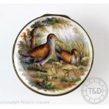A German porcelain box, 19th century, the circular box finely enamelled with birds to the cover,