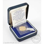 An Elizabeth II Golden Jubilee gold half sovereign dated 2002, within sealed capsule,