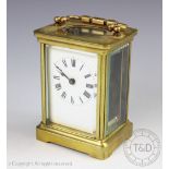 An early 20th century lacquered brass carriage timepiece,