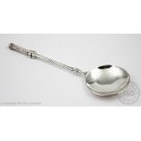 An Edward VIII Liberty & Co silver spoon, the Arts and Crafts spoon with foliate stem,