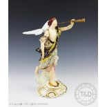 An 18th century Derby porcelain figure of an angel with a horn, poly chrome decorated,