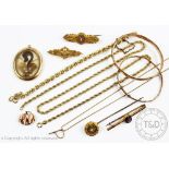 A collection of chains, bangles, Victorian brooches and a stick pin,