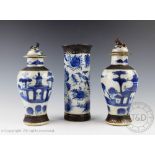 An associated pair of Chinese porcelain blue and white baluster vases and cover, 19th/20th century,