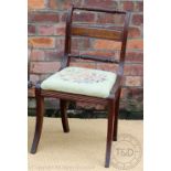 A set of four Regency mahogany dining chairs, with rope twist backs and drop in tapestry seats,
