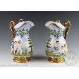 A pair of continental porcelain ewers and covers, early 20th century,