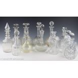 An assortment of twelve 19th century and later glass decanters and assorted stoppers,