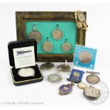 A selection of watches, coins and medallions, to include; a silver cased ladies fob watch,