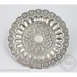 An Oomersi Mawji silver dish, late 19th century, of circular form,