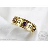 A garnet, amethyst, sapphire and diamond set ring,