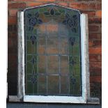 A pair of Edwardian Art Nouveau stained glass windows,