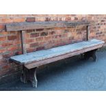 A vintage pine bench of long proportions,