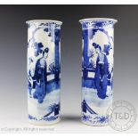 An associated pair of 19th century Chinese porcelain blue and white beaker vases,