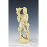 A Japanese carved ivory figure of a figure with two winged monkeys, Meiji Period 1868-1912,