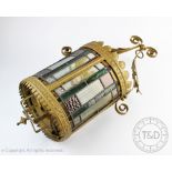 A late Victorian gilt metal and stained glass oval hall lantern, (at fault),