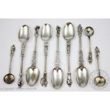 A set of six Continental silver Apostle type spoons, each with figural terminal and twisted stem,
