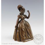 An early 20th century cast bronzed figural table bell,