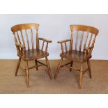 A set of four light beech country kitchen dining chairs,