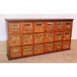 A vintage apothecary bank of drawers,