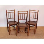 Three early 19th century elm and ash country chairs, with solid seats, on turned legs,