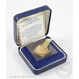 An Elizabeth II gold half sovereign dated 2000, within sealed capsule,