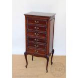 An Edwardian mahogany music cabinet, in French Hepplewhite style, with six drawers,