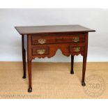 A George III and later oak low boy, the rectangular top with a moulded edge above three drawers,