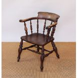 A 19th century ash and elm captains type chair, with solid seat, on turned legs,