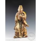 A large salt glazed pottery figure of a Chinese deity, 20th century,