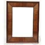 A 19th century walnut cushion frame type mirror, with moulded rectangular frame,