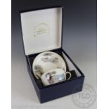 A Royal Worcester breakfast cup and saucer, printed with a shooting scene,