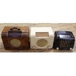 A Bush stained beech valve radio, model DCA 90A, with a bush bakelie radio, another vintage radio,