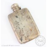 A silver hip flask, Chester early 20th century, marks rubbed, with concave back and bayonet top,
