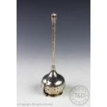An Arts and Crafts silver tea infuser, Liberty and Co Birmingham 1922,