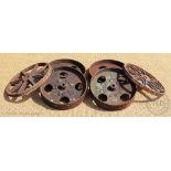 A set of four cast iron wagon wheels by Bellow & Sons, 35.