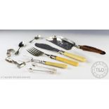 An assortment of silver and silver plated cutlery to include a pair of sugar nips,