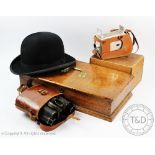 A pair of Sollux binoculars in leather case, a Kodak Brownie camera,