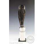 Joan Fitzgerald - 20th century American, a bronze model of an owl perched upon a shaped marble base,