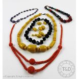 A collection of bead necklaces, to include; a black 'cube' necklace with Chinese white metal clasp,