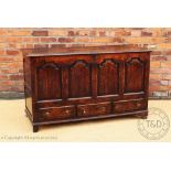 A George III oak mule chest, the front with arched panels and three drawers, on block feet,