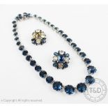 A Christian Dior necklace, designed as a riviere of blue faceted stones, all set in white metal,