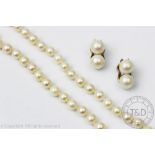 A single strand cultured pearl necklace with attached 9ct gold clasp and a pair of untested pearl