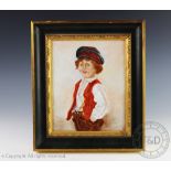 A 20th century Continental porcelain plaque of a young boy,